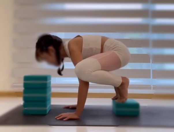 a child focusing on yoga mat